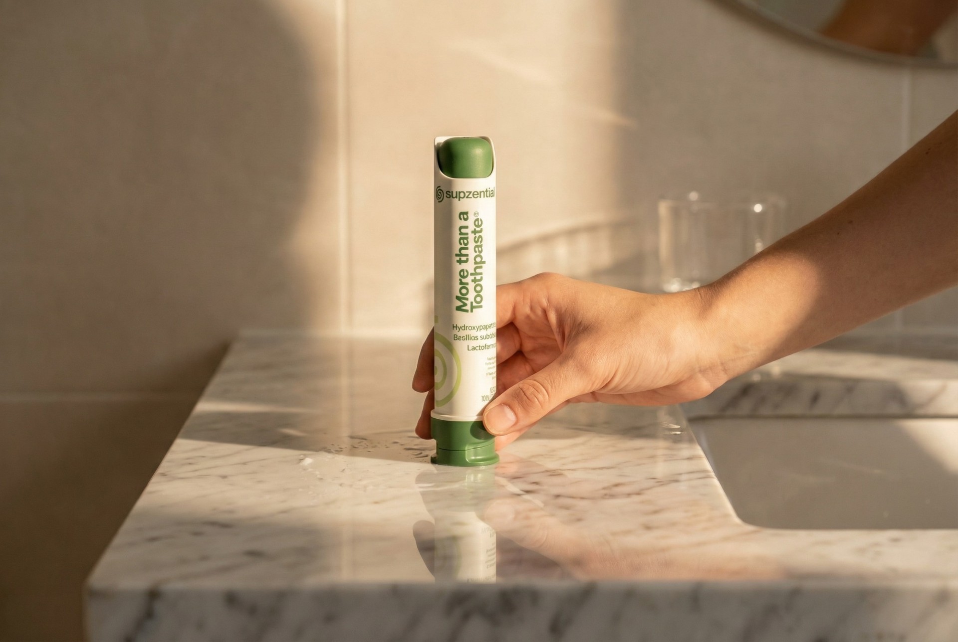 Supzential More Than a Toothpaste tube on a marble bathroom counter